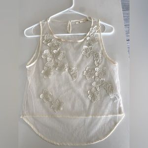 Delicate mesh top with flower appliqués